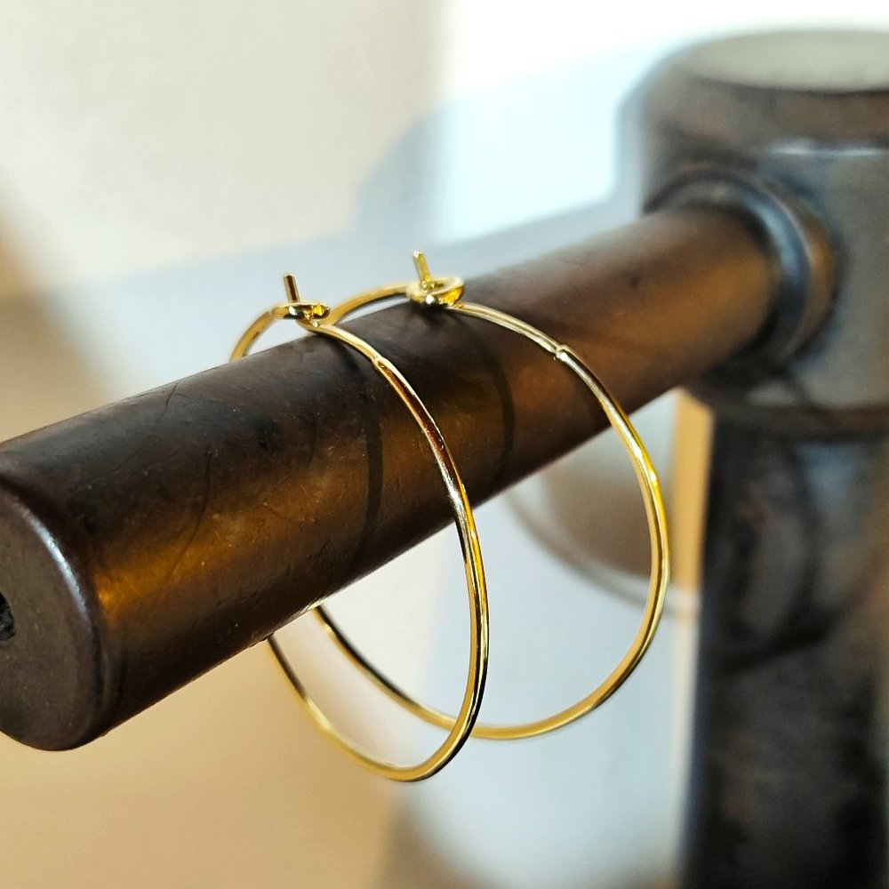 Hoop earrings. Earrings for women. 14k Yellow gold earrings with gentle design.